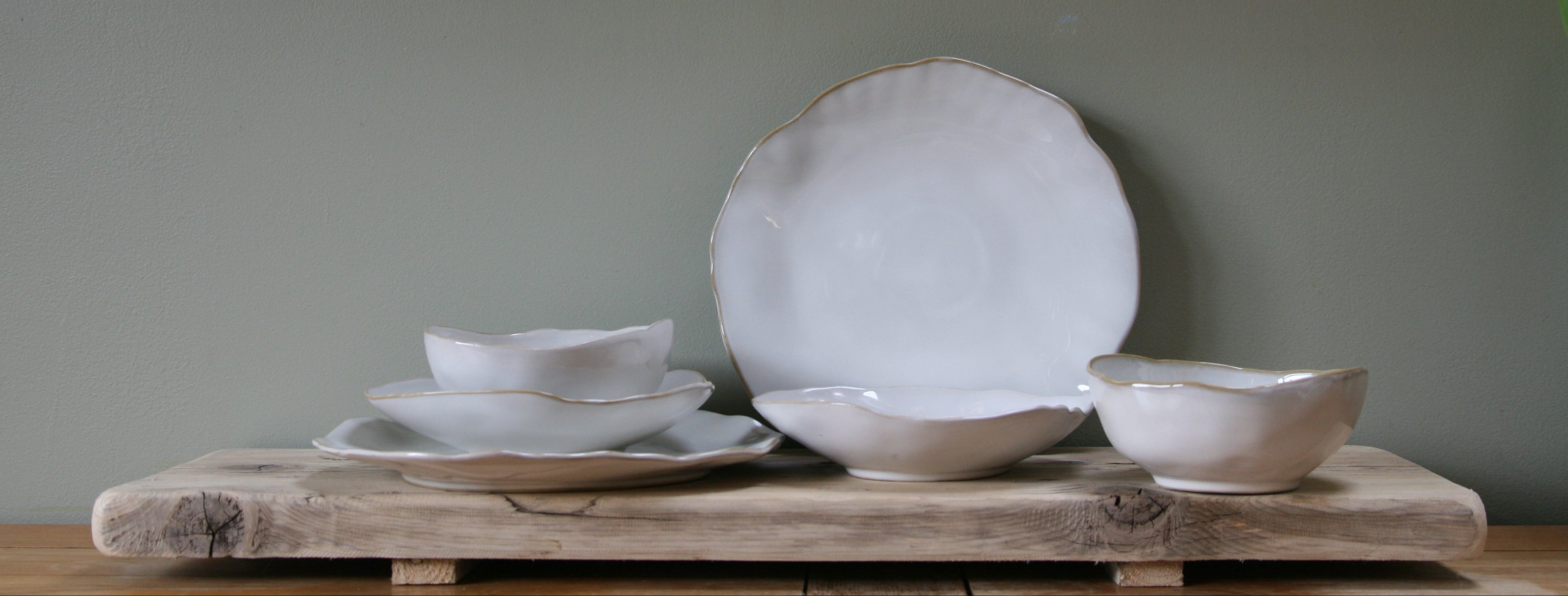Ceramic Dinner plate and bowl set White with irregular, wavey edges for an earthy handmade look. White reactive glaze with a warm golden tone rim.